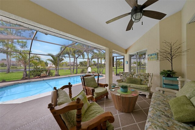 outdoor pool featuring an outdoor living space, glass enclosure, ceiling fan, and a patio