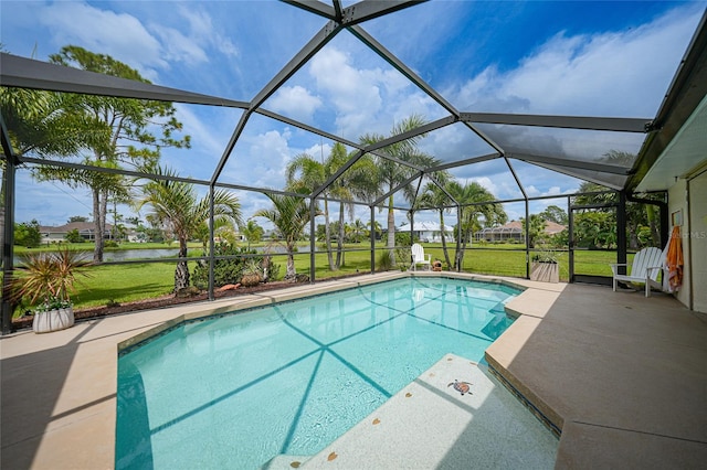 view of pool featuring glass enclosure, a yard, a water view, and a patio area