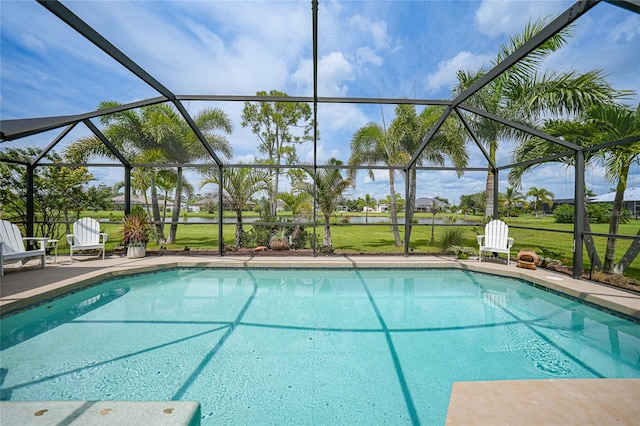 view of swimming pool with a lawn, a lanai, and a patio area