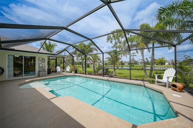 view of swimming pool with a lanai and a patio area