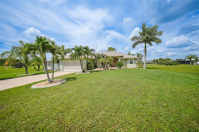 view of front of home with a front lawn, stucco siding, a garage, and concrete driveway