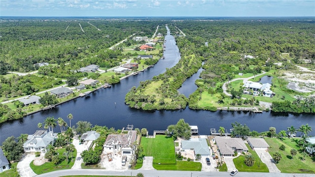 aerial view with a water view, a residential view, and a forest view
