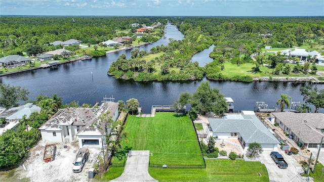 aerial view with a residential view, a water view, and a forest view