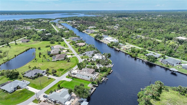 bird's eye view featuring a residential view and a water view
