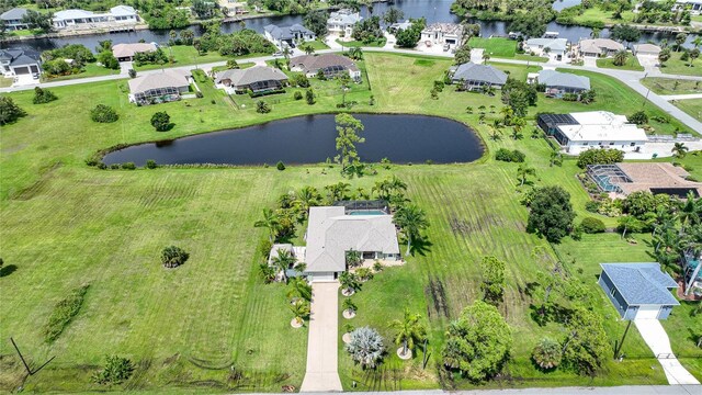 bird's eye view featuring a residential view and a water view