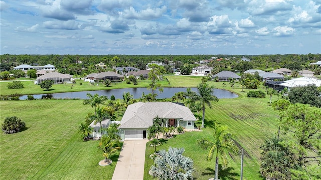 drone / aerial view with a residential view and a water view
