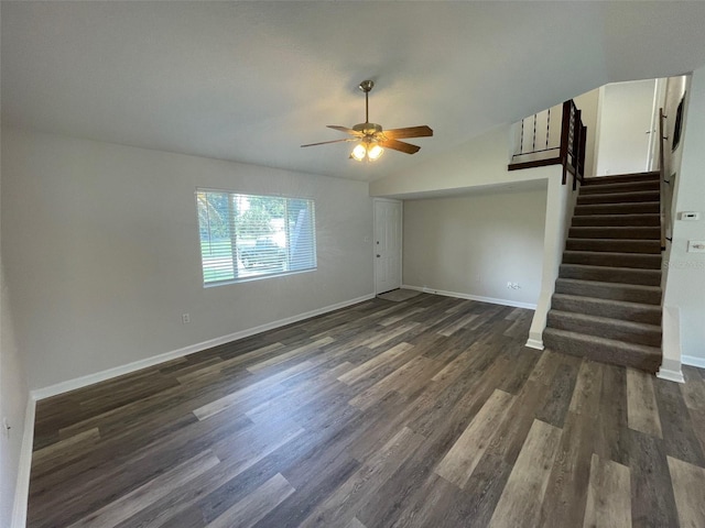 empty room featuring dark hardwood / wood-style flooring, ceiling fan, and lofted ceiling