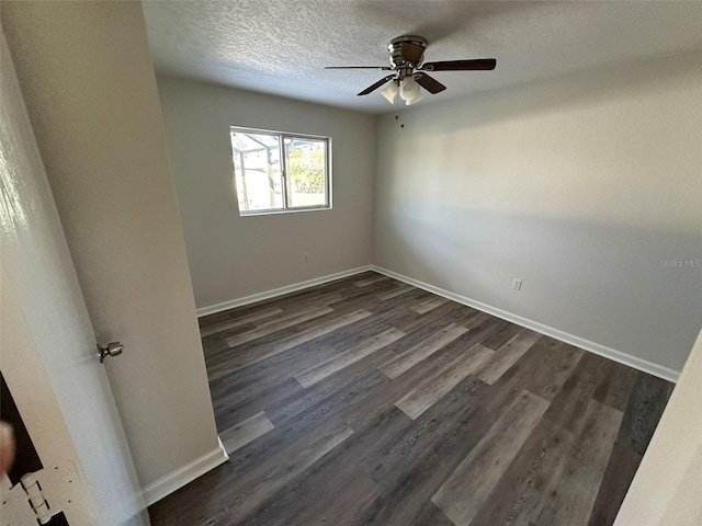 unfurnished room with a textured ceiling, ceiling fan, and dark wood-type flooring