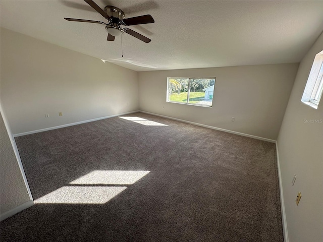 unfurnished room with carpet flooring, a textured ceiling, and ceiling fan