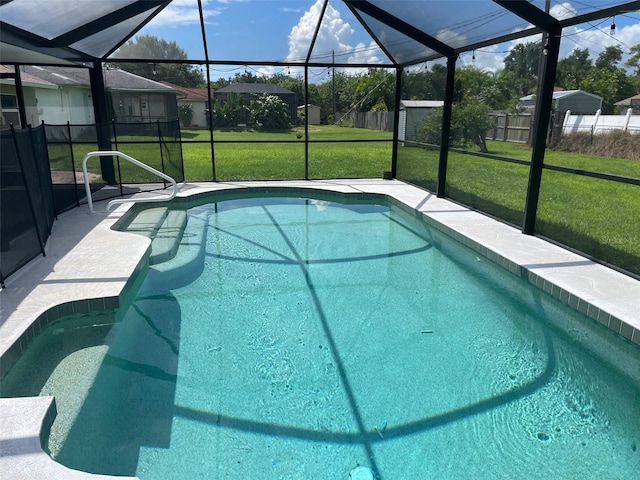 view of swimming pool featuring a lanai and a yard