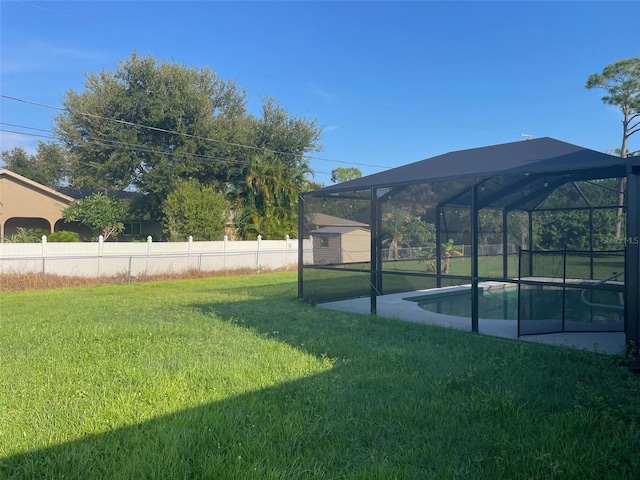 view of yard featuring a lanai and a fenced in pool