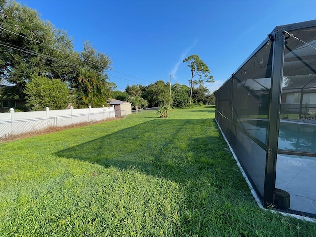 view of yard featuring a lanai