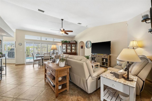 living room featuring tile patterned flooring, lofted ceiling, and ceiling fan