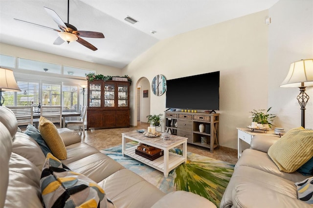 living room with ceiling fan and vaulted ceiling