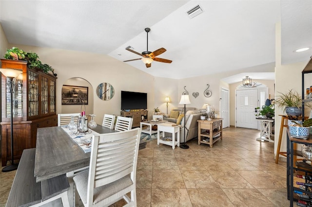 tiled dining area with lofted ceiling and ceiling fan