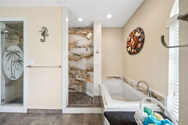 bathroom with separate shower and tub