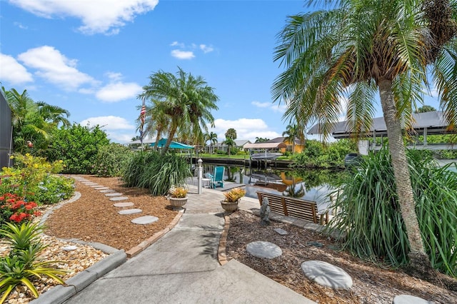 view of yard featuring a patio and a water view