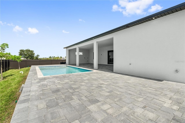 view of swimming pool featuring a patio area