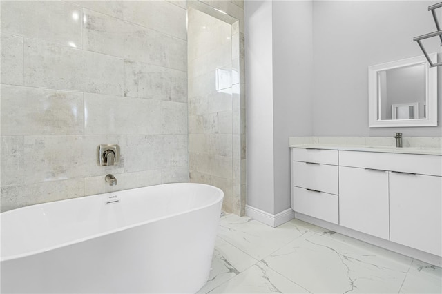 bathroom featuring a tub to relax in and vanity