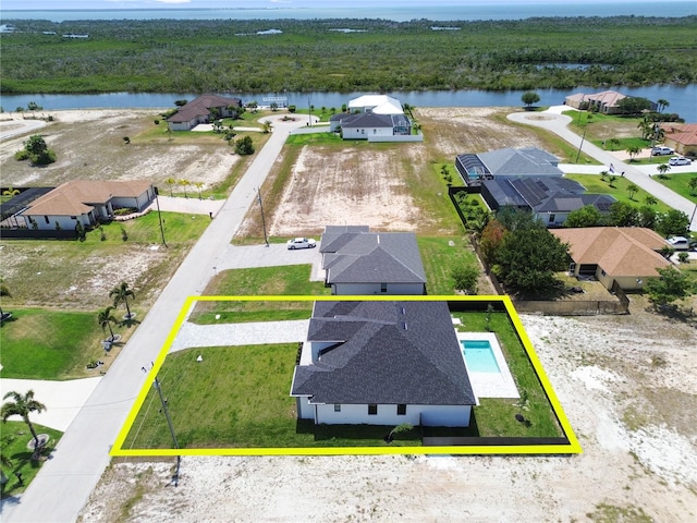 drone / aerial view with a water view