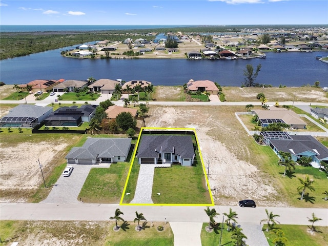 drone / aerial view with a water view