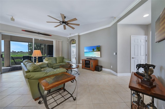 living room with ceiling fan, light tile patterned floors, and crown molding