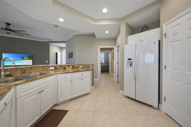 kitchen featuring crown molding, light tile patterned floors, sink, white cabinets, and white appliances