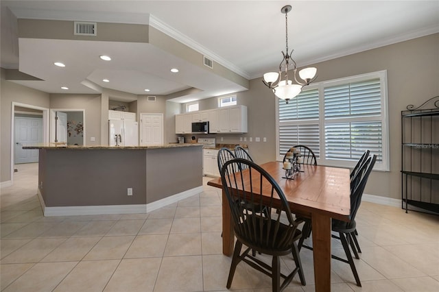 3959 San Rocco Ct Unit 911, Punta Gorda, FL 33950 - dining area featuring light tile patterned floors, ornamental molding, baseboards, and a chandelier