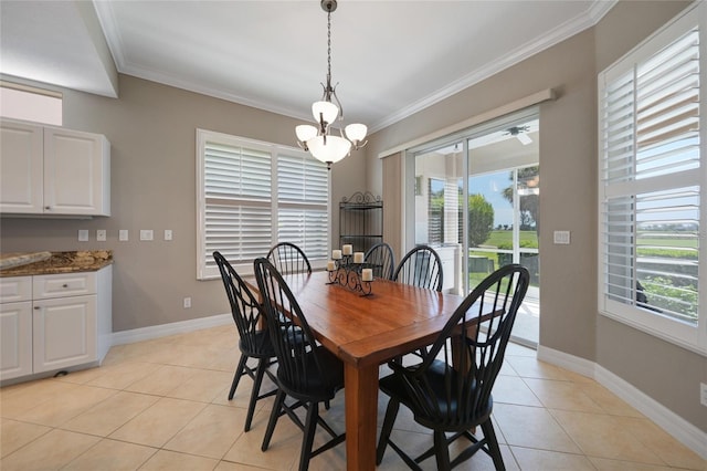 dining room with ornamental molding, a wealth of natural light, a notable chandelier, and light tile patterned floors