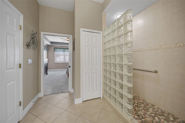 bathroom featuring a shower, tile patterned floors, and ceiling fan