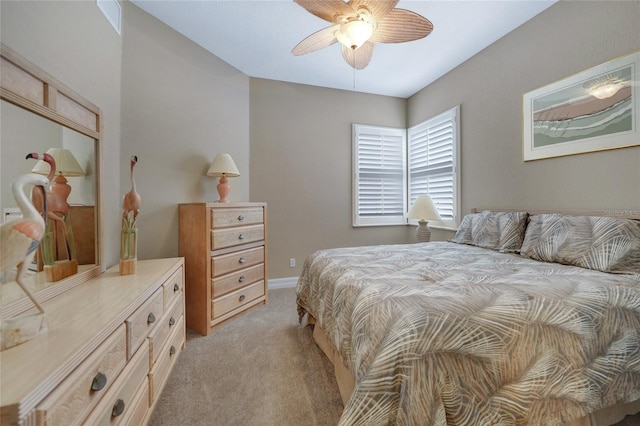 bedroom with light colored carpet and ceiling fan