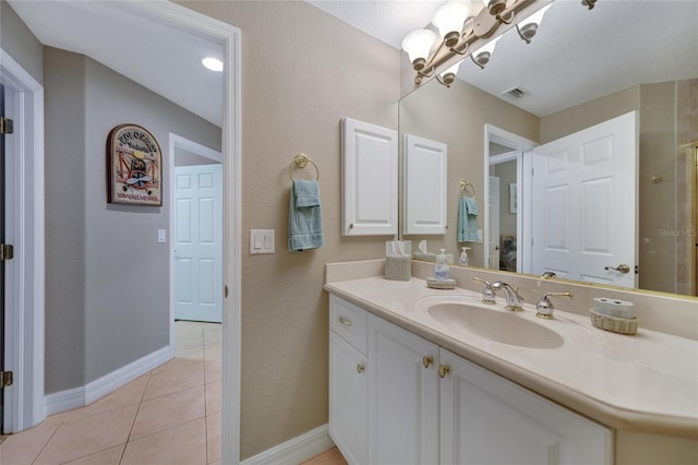 bathroom with tile patterned flooring and vanity