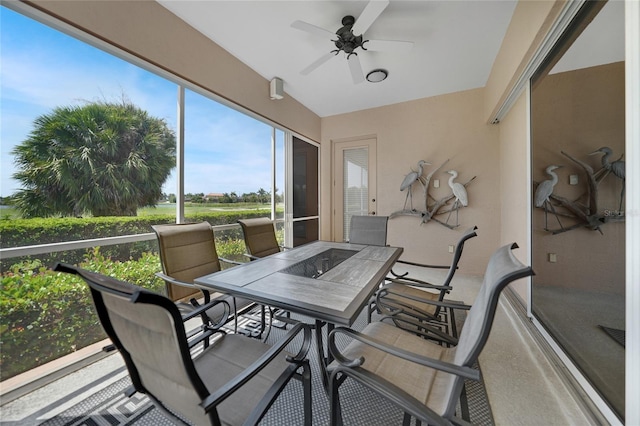 sunroom featuring ceiling fan