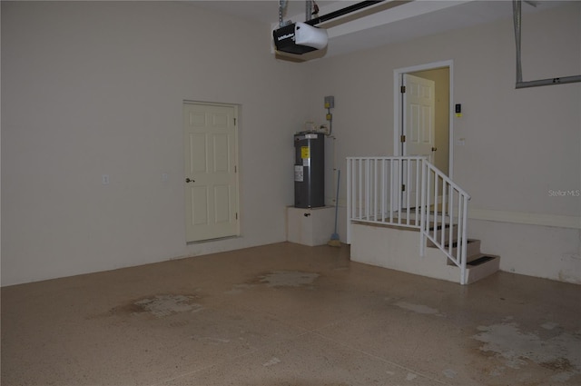 garage with a garage door opener and electric water heater