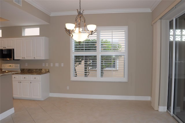 kitchen featuring white cabinetry, decorative light fixtures, dark stone countertops, and an inviting chandelier