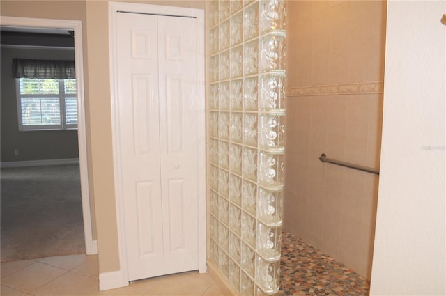 bathroom featuring tile patterned flooring and a shower