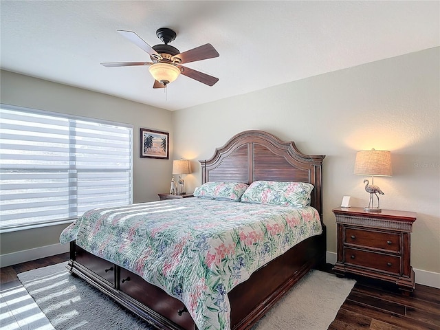 bedroom featuring ceiling fan and dark wood-type flooring