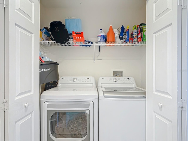 laundry area with washing machine and clothes dryer