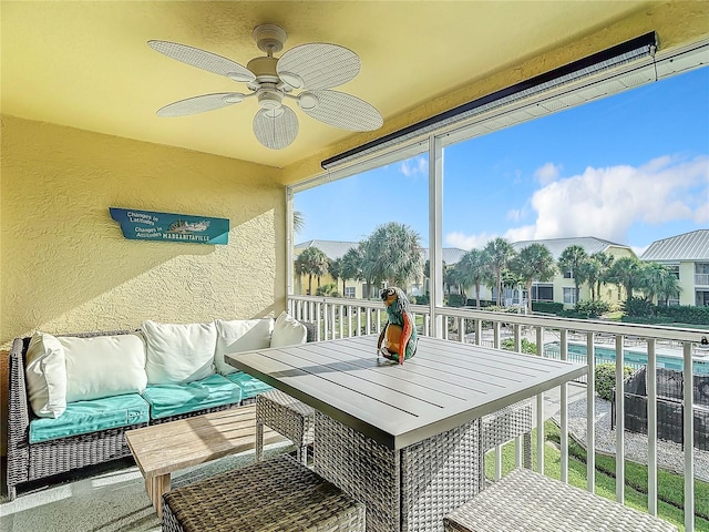 sunroom / solarium with ceiling fan