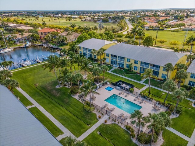 birds eye view of property with a water view