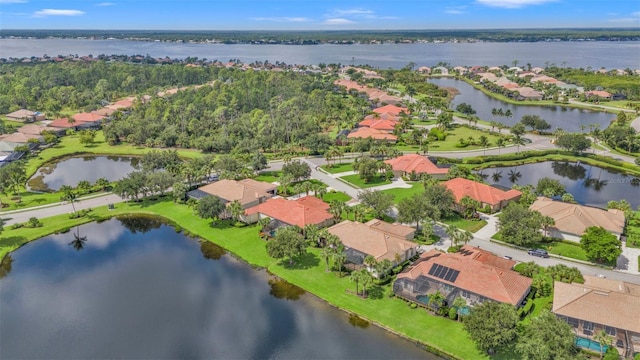 aerial view with a residential view and a water view