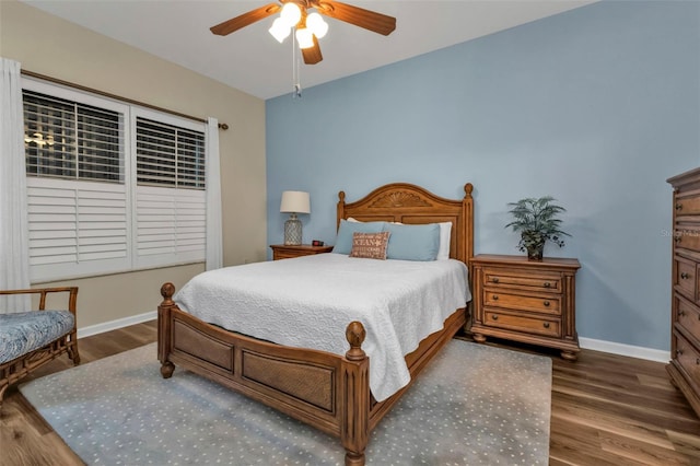 bedroom featuring ceiling fan and dark hardwood / wood-style flooring