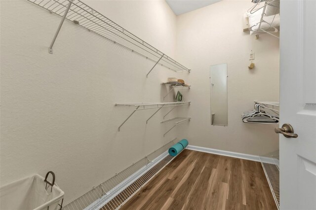 laundry room featuring wood-type flooring