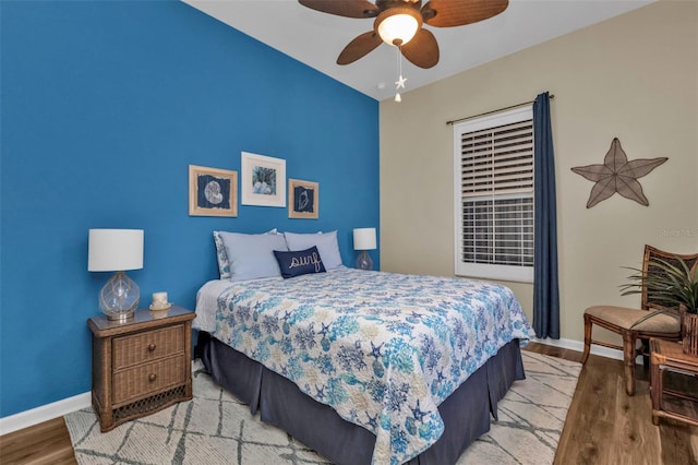 bedroom featuring light hardwood / wood-style flooring and ceiling fan