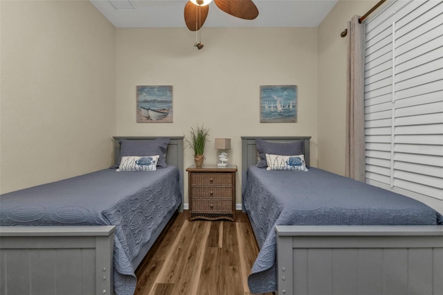 bedroom featuring ceiling fan and dark hardwood / wood-style flooring