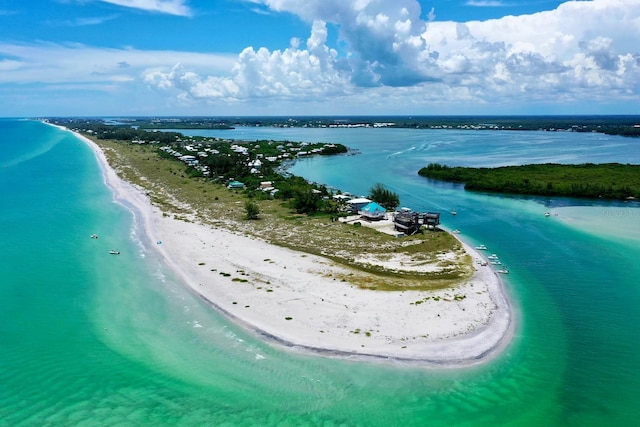 aerial view with a water view and a view of the beach