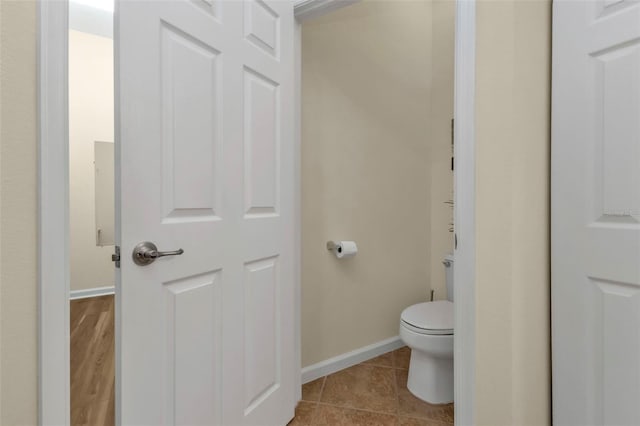 bathroom featuring tile patterned flooring and toilet