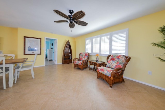 sitting room with ceiling fan