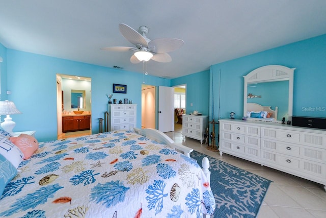 bedroom featuring connected bathroom, ceiling fan, and light tile patterned floors