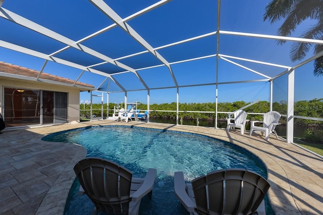 view of pool with a lanai and a patio area